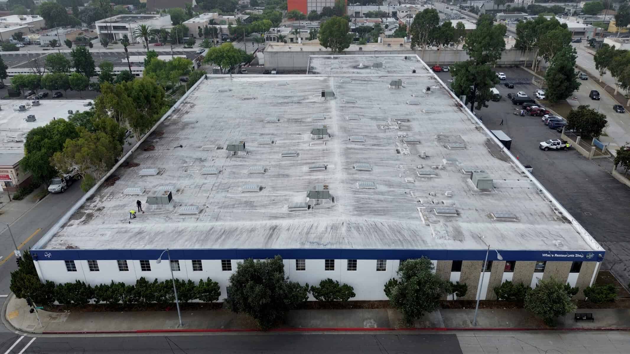 commercial flat roof before coating showing wear and aging
