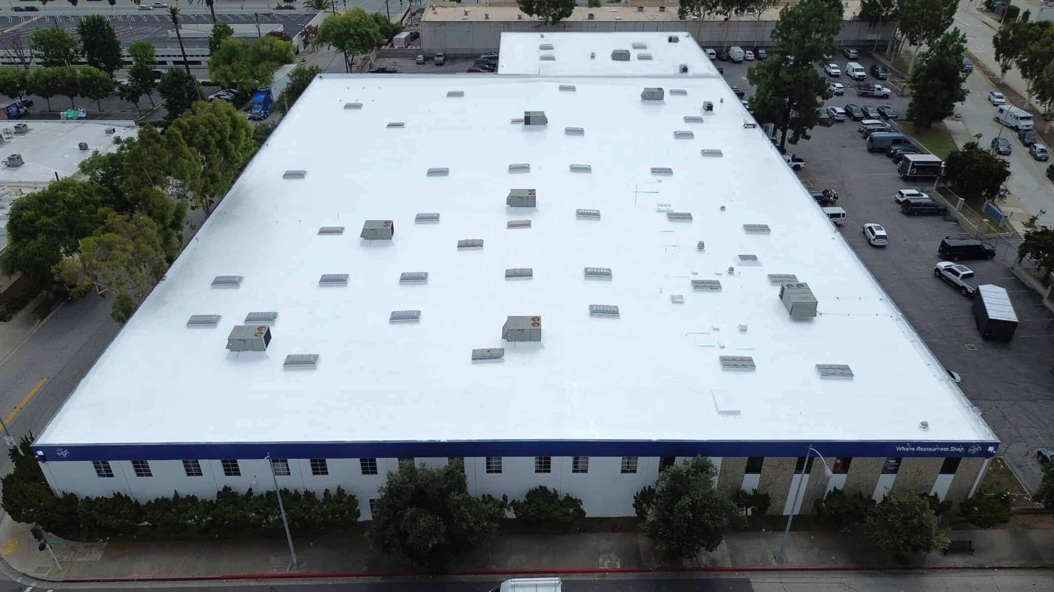 completed commercial flat roof silicone coating project on large building