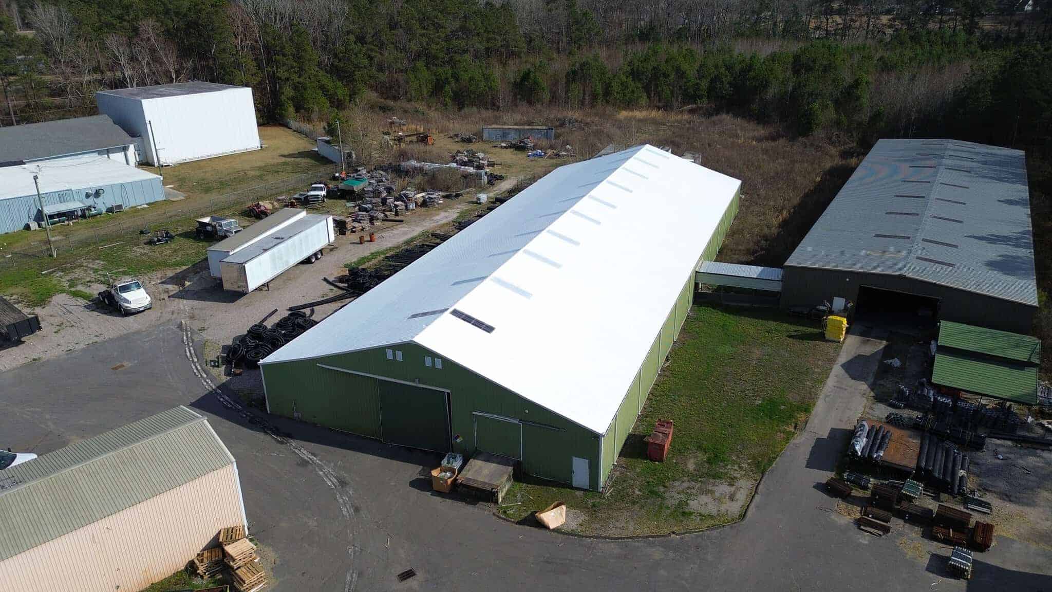 large commercial building roof coating project aerial view